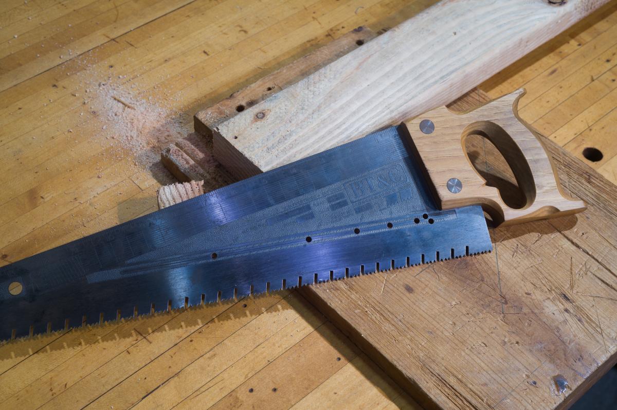 Using the hardware store saw to layout and square the ends of a 2x4 so I can turn it into a part of a project